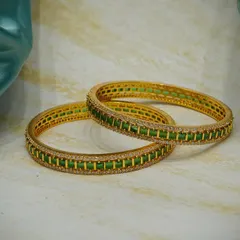 Another look at our stunning green stone kadas against a soft background. The quality and finish of our imitation jewellery make it a wonderful and affordable choice for any celebration.