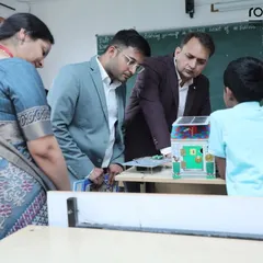 An instructor provides guidance as a student presents his project. These interactions are key to our process, ensuring students feel supported as they step out of their comfort zone to showcase their talent and build confidence.