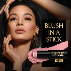A commercial shot for Lakmé's 'Blush in a Stick'. The model's soft, rosy cheeks are the focus, demonstrating the product's natural-looking color payoff. The stick format and a swatch are shown for complete product information.