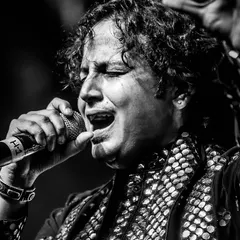 Lost in the music, connected to the divine. This is the state of 'suroor' we aim to create at every performance. A black and white moment capturing the raw emotion of our lead vocalist during a live show at Bangalore Club.