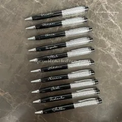 Put your brand in every hand with our custom pens. These elegant black and crystal pens are engraved with names, making them a perfect and memorable corporate gift.