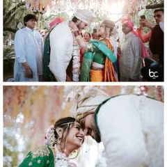 Two beautiful moments from a Marathi wedding: the varmala exchange under a floral canopy and an intimate, joyous forehead touch.