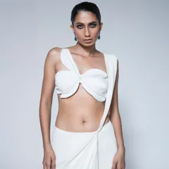A close-up of the knotted blouse from the House of R draped saree. This shot highlights the unconventional design and modern aesthetic of the ensemble, styled with simple earrings to maintain focus on the outfit.