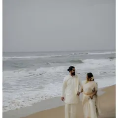 A cinematic walk along the serene Kerala coastline. This frame showcases our love for destination wedding photography, blending the grandeur of the landscape with the intimacy of the couple's journey.