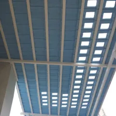 For this project, we created a unique Santorini-themed pergola with a blue roof and square cutouts. It lets in beautiful patterns of light while providing shade and a pop of color.