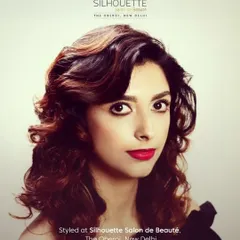 Another stunning look for author Aishwarya Jha. Here, we opted for a bold red lip and voluminous, retro-inspired curls, showcasing a completely different but equally powerful and glamorous style.