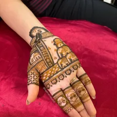 The design now extends to the palm, featuring a procession of royal elephants, a symbol of good luck and prosperity.