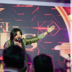 A shot of me engaging with the audience during a large-scale event. My role is to be the bridge between the band and the listeners.