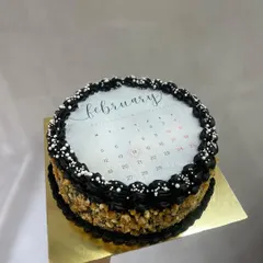 Mark your special date with a calendar-themed burn away cake. This one, with its dark chocolate and nut crumble design, is perfect for celebrating an anniversary or Valentine's Day.