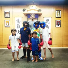Safety is my number one rule. When kids advance to light sparring drills, full protective gear, including headgear and shin guards, is mandatory. This allows them to practice their skills with confidence.