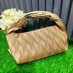 The same popular ruched handle bag, shown here in a versatile gold color. It can be paired with a wide range of traditional and western outfits.