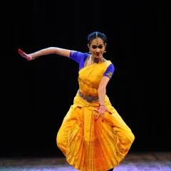 A moment from my performance of 'Maam Pahi' on stage. As a performer, I bring my passion and experience into every class, sharing the depth and dynamism of Bharatanatyam with my students.