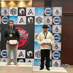 Two of our team members on the podium after battling it out in their division. This shows the spirit of our club, where we push each other to be the best.