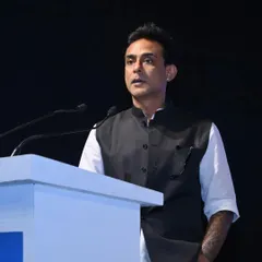 A keynote speaker delivers a presentation on stage, sharing valuable knowledge with an engaged audience of industry professionals.