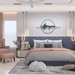 A serene and stylish master bedroom designed for ultimate comfort. The room features a custom blue headboard, elegant pendant lights, and a soft pink armchair, creating a perfect balance of color and tranquility. This is a prime example of our personalized bedroom interior design.