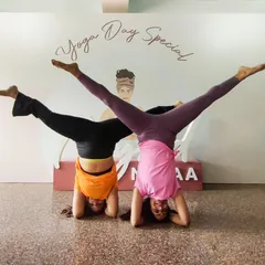 This is not just a yoga day post, it's a celebration of friendship and progress. My friend Monica and I started our yoga journeys together, and here we are, holding a split-leg headstand variation.