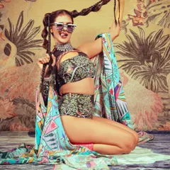 A playful shot showing how the makeup and hair work with accessories to create a cohesive and interesting character for the editorial.