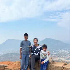 A mother with her two sons at a scenic viewpoint during a family trek. Our adventures are designed to help families bond and create cherished memories in the great outdoors.