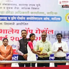 Anamika Avinash Aher receives her gold medal trophy at the State-Level School Drop-Roll ball Championship.
