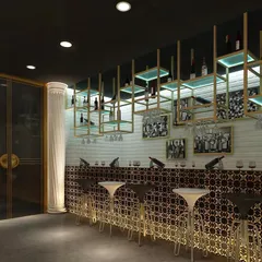 Another view of the smoke lounge bar. This shot highlights the backlit bar front with its geometric pattern and the hanging glass and bottle racks that are both functional and decorative.