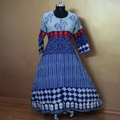 I love playing with prints, and this long Anarkali combines multiple blue and white patterns in one harmonious design. The red embroidered band adds a pop of contrasting color.