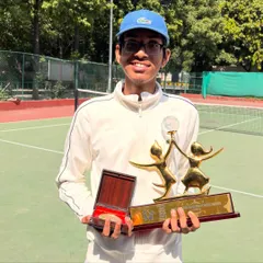 Celebrating a global honor. Lakshmi holds his 2025 Global Child Prodigy Award, a prestigious recognition of his talent and spirit. This photo was taken on our home court, where all the hard work and preparation happens every day.