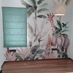 For this kid's room, I fitted a green fabric Roman blind that complements the jungle-themed wallpaper. This is a good example of how I coordinate window treatments with your room's decor.
