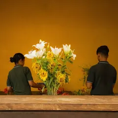 Our staff carefully arrange fresh sunflowers and lilies. We believe fresh flowers bring life and beauty into our spaces.