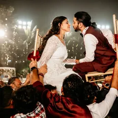 The energy of a Jewish wedding celebration is electric. Here, the bride and groom are lifted on chairs during the Hora dance, sharing a look of pure joy. I live for capturing these peak moments of celebration and tradition.