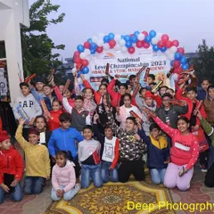 Victory! Our young champions celebrate their success at the National Level Championship. This moment captures the joy and pride that comes from dedication and hard work.