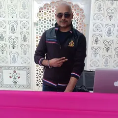 A candid shot of me at an outdoor daytime event. No matter the setting, I am always ready to spin some tunes and enjoy the musical vibes.