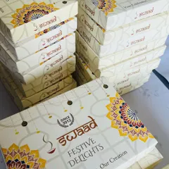 We are fully equipped to handle large-scale corporate gifting orders. This image shows stacks of our custom-branded 'Festive Delights' boxes ready for dispatch, a popular choice for companies during Diwali and other celebrations.