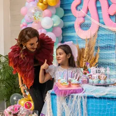 A thumbs-up from the birthday girl! We love seeing our little clients so happy with their party. It's a joy to celebrate these special milestones with you.