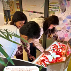 Before children step into the classroom, parents take the first step. At our Parent Orientation, adults engage in hands-on watercolor exploration on a light table, experiencing our play-based philosophy for themselves.