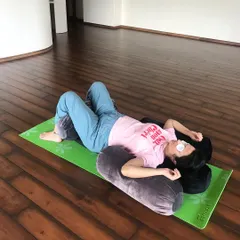 Comfort is key to a nourishing practice. Here, a mother-to-be finds deep rest supported by bolsters and an eye pillow. I believe in using props to help you release tension, find proper alignment, and surrender completely.