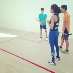 Coach Shruti Settipalli, an international professional player, provides on-court guidance to two of our young athletes. Our coaching team brings real-world pro circuit experience to every session.