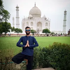 Finding balance with Vrikshasana, the tree pose, in front of the Taj Mahal. Yoga is a tool you can carry with you anywhere.