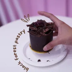This is our take on the classic Black Forest pastry. It's a perfect single serving of rich chocolate cake, whipped cream, and cherries, all wrapped in a delicate chocolate shell.