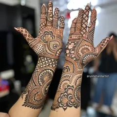 A beautiful blend of modern and traditional patterns. This design features bold floral mandalas, checkerboard fills, and flowing paisleys, covering the hands and arms completely.