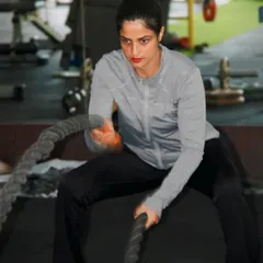 I believe in leading by example. Here I am with the battle ropes, a fantastic tool we use in our functional training sessions for a full-body workout that builds power and endurance.