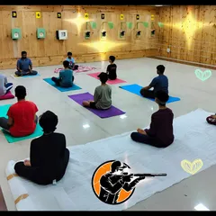 A morning yoga session at our range. Starting the day with meditation and yoga helps our shooters build the immense focus needed to excel in this sport.