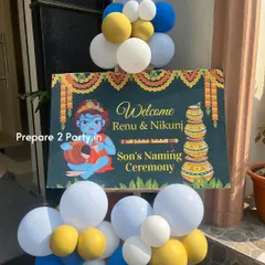 A close-up of the personalized welcome sign for a son's naming ceremony. The sign features a cute illustration of Little Krishna, setting the theme right from the entrance.