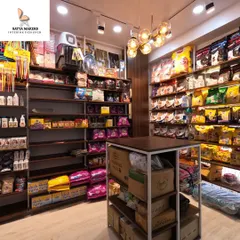 Effective merchandising requires thoughtful store layout design. Here, the custom shelving provides ample space for a wide variety of pet products, ensuring everything is organized, accessible, and easy for customers to browse.