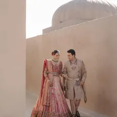 A quiet walk through the sunlit corridors of Fairmont Jaipur. My styling focused on the beautiful contrast between the couple's soft pastel Tarun Tahiliani outfits and the grand, monolithic architecture of the palace.