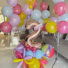 Every balloon tells a story, and this one shouts "I'm TWO!" This colorful stand-up bouquet with a rose gold number is a fun and vibrant centerpiece for a toddler's birthday.