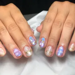 This abstract set has a celestial, galaxy-like feel, with a mix of purple and blue watercolor effects, gold accents, and a "sugar" glitter nail.