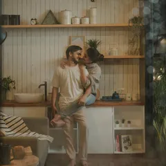 A playful and tender moment in a beautifully styled kitchen. This kind of indoor pre-wedding shoot is perfect for capturing the everyday romance and comfort of a shared life.