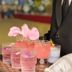 Service with a smile and a touch of magic. My staff presents a tray of our most popular mocktails, including the beautiful Pink Bubblegum drink topped with cotton candy.