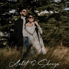 A candid, happy moment in the tall grasses of the Himalayan foothills. This pre-wedding portrait captures the carefree spirit of a destination shoot in nature.