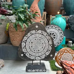 Mixing it up with our Aztec-inspired wooden carved panels. This piece features a bold, geometric design in black and white, mounted on a stand to be used as a sculptural accent on a console or floor.